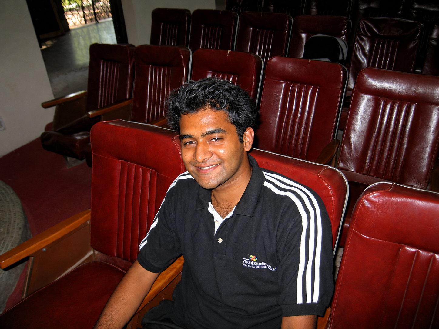 Bhasker Kode in college, wearing a Microsoft Visual Studio polo